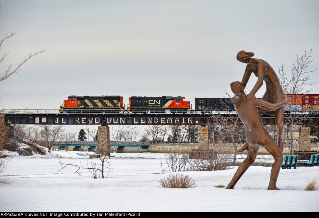 CN 9543 leads 559 over the river bridge